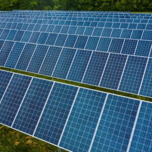 A vibrant solar farm showcasing rows of photovoltaic panels capturing energy.