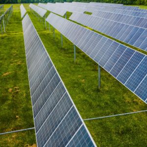 Aerial view of solar panels in a green field, Rossville, GA.